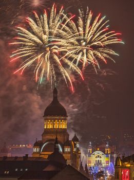 Beautiful fireworks show takes place in Avram Iancu Square in Cluj Napoca with the ocassion of The Romanian National day on 1 December 2013 in Cluj Napoca, Romania.