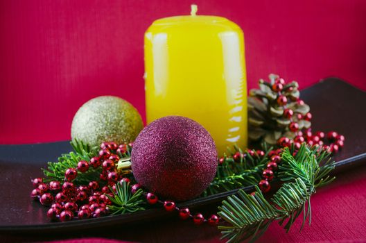 Christmas candle on a red background