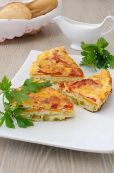 baked omelet pieces of zucchini, carrot, tomato, cheese