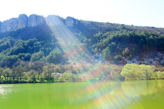 Ray of sunshine from the mountain lake. Mangup-Kale, Crimea, Ukraine, 