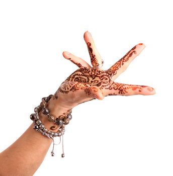 Female hand gesture of oriental dance. Female hand with henna painted on the white background
