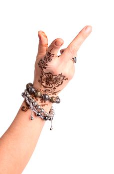 Female hand gesture of oriental dance. Female hand with henna painted on the white background
