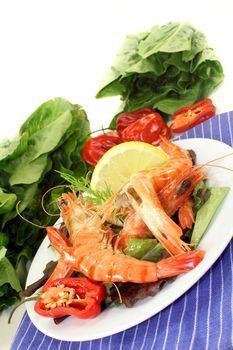 Black Tiger shrimp with lemon on curled lettuce