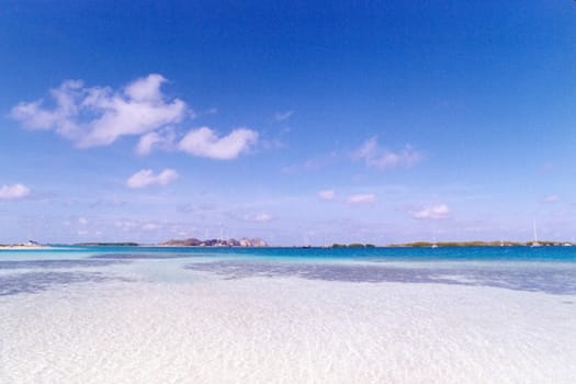 Scenic view of blue sky and cloudscape over white sandy beach, Los Roques, Venezuela.