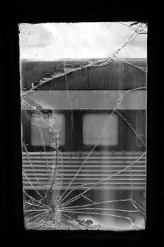 Detail of a broken window on a train.
