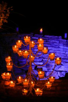 Candles lit up at night in front of a wall, Buzios, Rio De Janeiro, Brazil