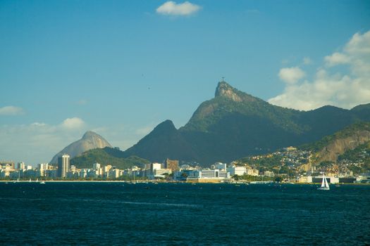 City at the waterfront with Christ the Redeemer on top of Corcovado Mountain in background, Rio De Janeiro, Brazil