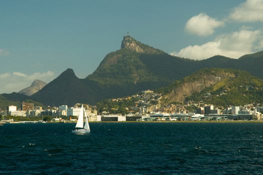 City at the waterfront with Christ the Redeemer on top of Corcovado Mountain in background, Rio De Janeiro, Brazil