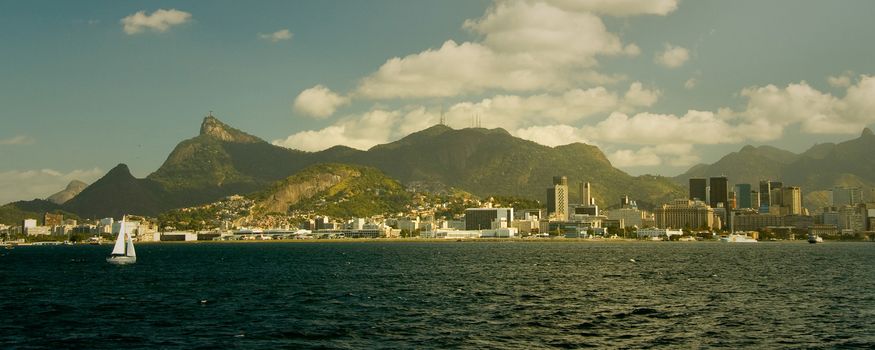 City at the waterfront with Christ the Redeemer on top of Corcovado Mountain in background, Rio De Janeiro, Brazil