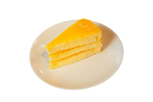 Orange cake on dish isolated on white