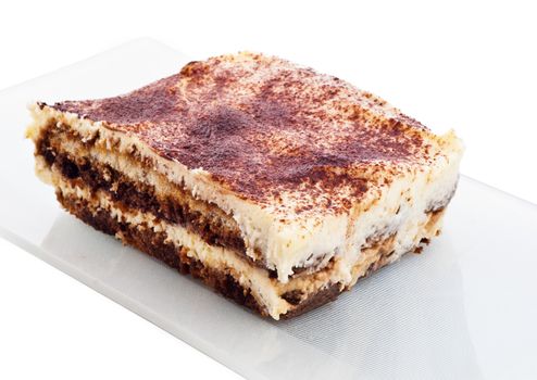 tiramisu cake on white plate isolated on white background