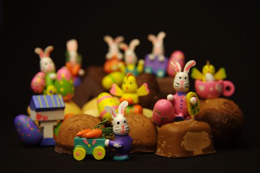 Close-up of Easter bunnies with cakes and Easter eggs