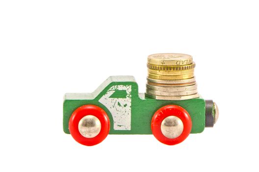vintage wodoen truck toy and money coins concept.Isolated money truck