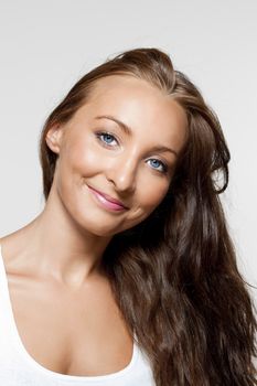 portrait of a young beautiful woman with brown hair and blue eyes