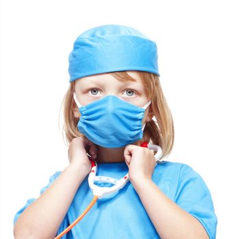 boy with long blond hair playing a doctor