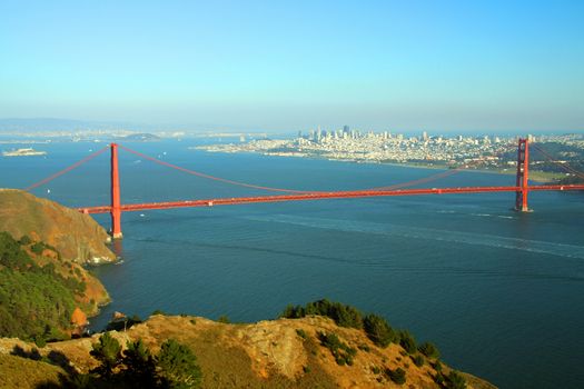 Scenic view of Golden Gate Bridge with Alcatraz island and city in background, San Francisco, California, U.S.A.