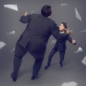 two businessmen fighting as sumoists, the concept of competition in business