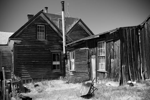 Historic dilapidated wooden buildings at Bodie Park a Californian gold-mining ghost town.