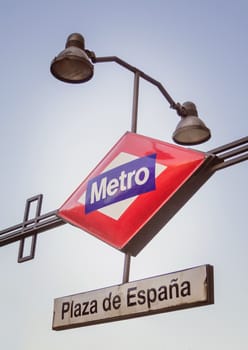 Plaza de España metro sign over blue sky background in Madrid, Spain