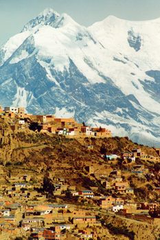 Scenic view of La Paz city with snow covered mountains in background, Bolivia.