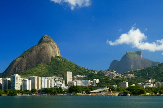 A view of the Lagoa Rodrigo de Freitas in Rio de Janeiro with the Pedra da Gavea in the background on a beautiful sunny day.