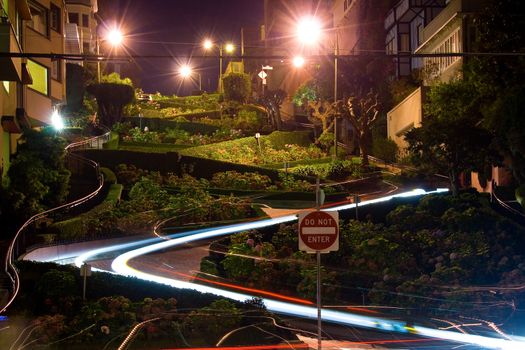 Scenic view of Lombard street at night with colorful lights of driving cars, San Francisco, U.S.A.
