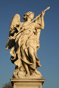 Low angle view of an angel statue on the top of a bridge, Ponte Sant Angelo, Rome, Lazio, Italy