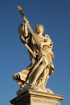 Low angle view of an angel statue on the top of a bridge, Ponte Sant Angelo, Rome, Lazio, Italy