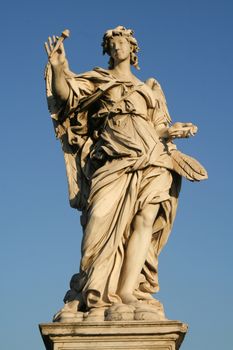 Low angle view of an angel statue on the top of a bridge, Ponte Sant Angelo, Rome, Lazio, Italy