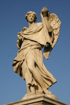 Low angle view of an angel statue on the top of a bridge, Ponte Sant Angelo, Rome, Lazio, Italy