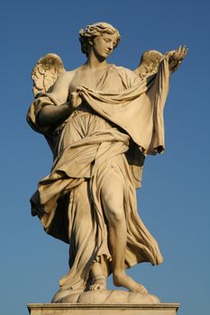 Low angle view of an angel statue on the top of a bridge, Ponte Sant Angelo, Rome, Lazio, Italy