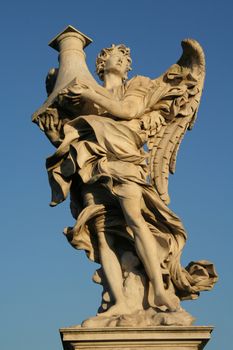 Low angle view of an angel statue on the top of a bridge, Ponte Sant Angelo, Rome, Lazio, Italy