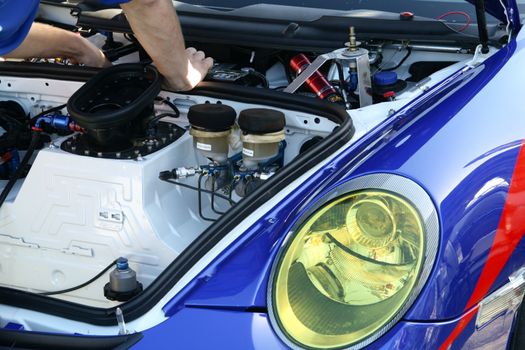 Mechanic repairing a racecar engine, Homestead, Miami, Miami-Dade County, Florida, USA