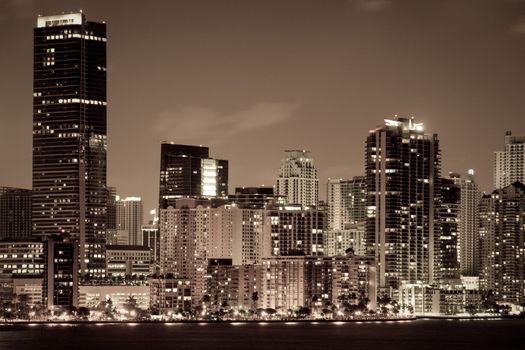 Skyscrapers lit up at dusk in a city, Miami, Miami-Dade County, Florida, USA