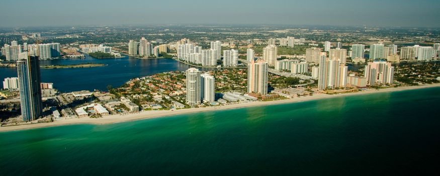 Panoramic view of Miami skyline showing waterfront and calm sea, Florida, U.S.A.