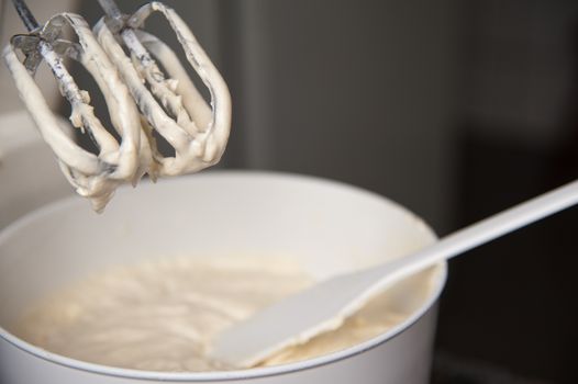 Detail of a mixer with cream on it