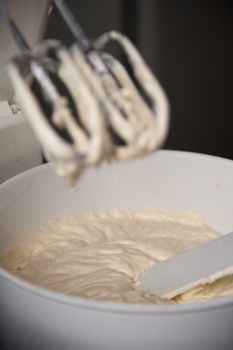 Detail of a mixer with cream on it