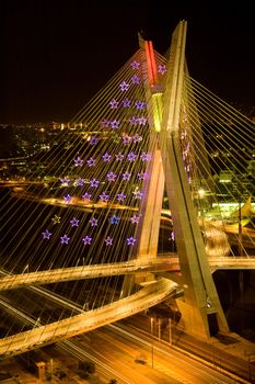 Nighttime view of a complicated modern bridge structure.  Sao Paulo, Brazil.