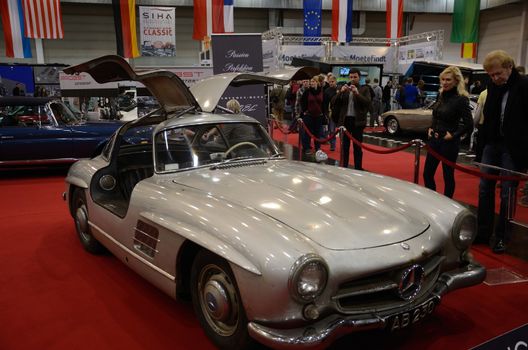 ESSEN, GERMANY - November 30: Visitors admire classic Mercedes 300SL during Essen Motor Show in Germany, on November 30, 2013.