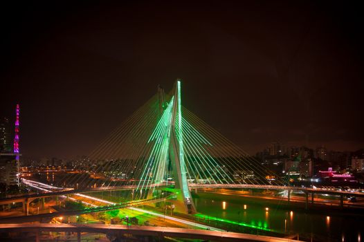 Most famous bridge lit up in the city at night, Octavio Frias De Oliveira Bridge, Pinheiros River, Sao Paulo, Brazil