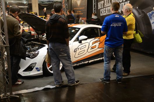 ESSEN, GERMANY - November 30: Visitors admire tunned cars during Essen Motor Show in Germany, on november 30, 2013.