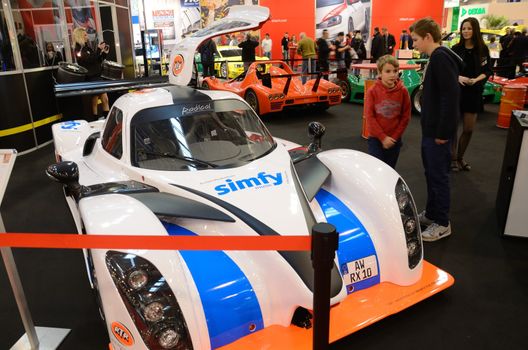 ESSEN, GERMANY - December 1: Visitors admire tunned cars during Essen Motor Show in Germany, on December 1, 2013.