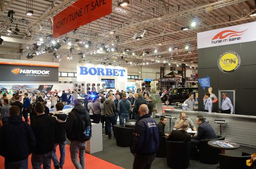 ESSEN, GERMANY - December 2: Visitors admire tunned cars during Essen Motor Show in Germany, on December 2, 2013.