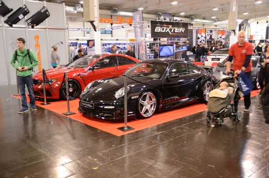 ESSEN, GERMANY - December 5: Visitors admire tunned cars during Essen Motor Show in Germany, on December 5, 2013.