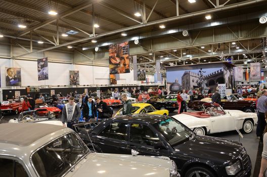 ESSEN, GERMANY - December 8: Visitors admire classic cars from Europe and USA during Essen Motor Show in Germany, on December 8, 2013.