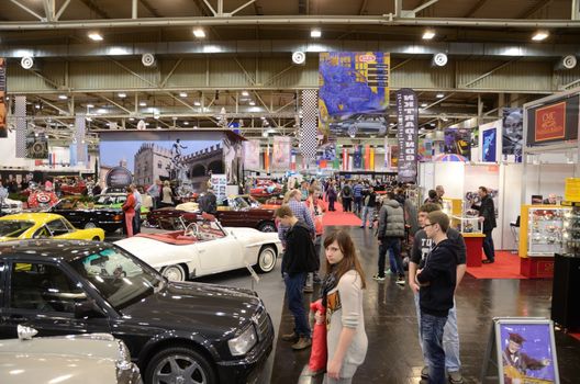 ESSEN, GERMANY - December 8: Visitors admire classic cars from Europe and USA during Essen Motor Show in Germany, on December 8, 2013.