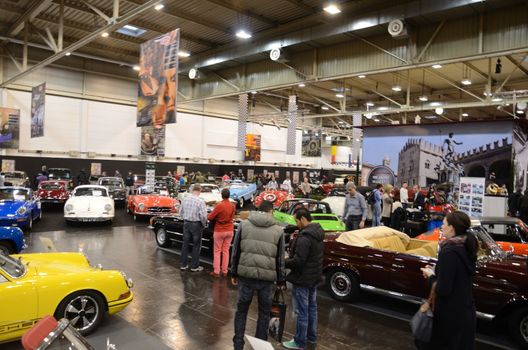 ESSEN, GERMANY - December 8: Visitors admire classic cars from Europe and USA during Essen Motor Show in Germany, on December 8, 2013.
