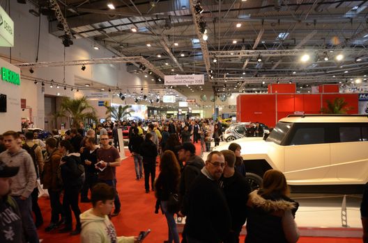 ESSEN, GERMANY - December 8: Visitors admire modern cars during Essen Motor Show in Germany, on December 8, 2013.