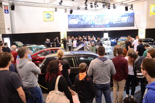 ESSEN, GERMANY - December 8: People admire cars during Essen Motor Show in Germany, on December 8, 2013.