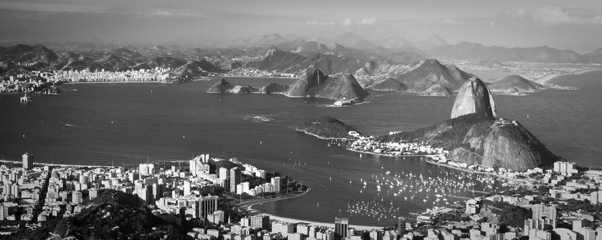 A black and white toned image of Rio de Janeiro seen from above.